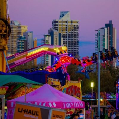 show-rides-early-evening-with-buildings-in-background
